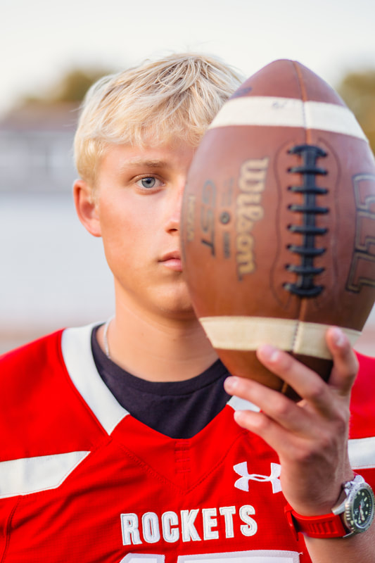 Senior boy with football