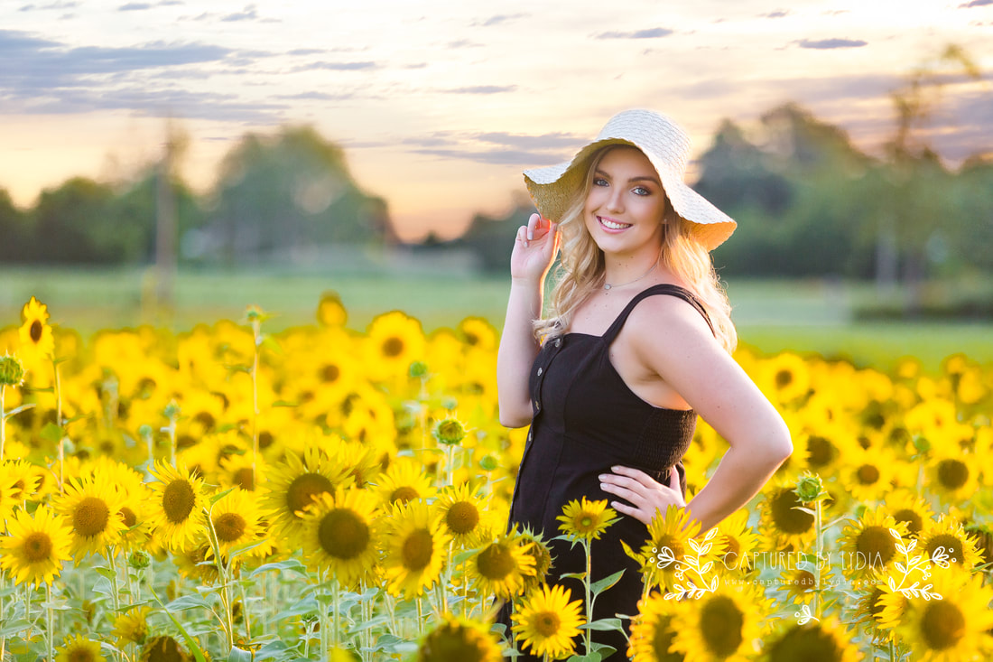Senior in sunflower field